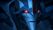 a close up of a robot with red eyes in the dark