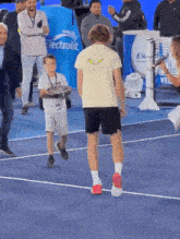 Andrey Rublev Wholesome Andrey Rublev Adorable GIF - Andrey Rublev Wholesome Andrey Rublev Adorable Andrey Rublev Picking Up A Ballboy GIFs