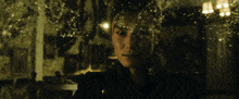 a close up of a woman 's face behind a glass