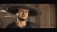 a man wearing a hat with a chinese symbol on the wall behind him