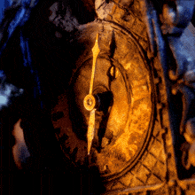a close up of a clock face with the hands pointing to the numbers 1 and 12