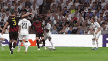 a soccer player with the number 21 on his back