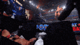 a wrestling ring with a sign that says nxt