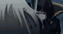 a man and a woman are standing next to each other and the woman is holding a sword in her hand .