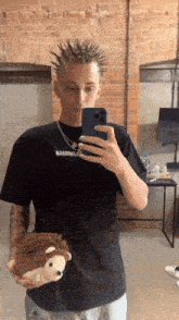 a man taking a picture of himself with his phone