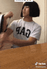 a man wearing a shirt that says 4a3 on it