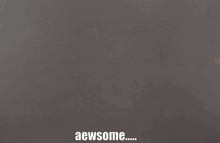 a gray background with the words aewsome written on it