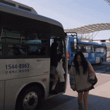 the number 1544-8963 is on the side of the bus