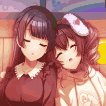 two anime girls with their eyes closed and one wearing a hoodie