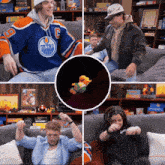 a man wearing an edmonton oilers jersey sitting on a couch