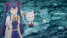 a girl with purple hair stands next to two cats one of which is happy