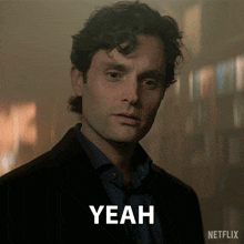 a man in a suit is standing in front of a netflix logo