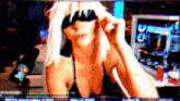 a woman wearing blindfolds is playing a game on twitch
