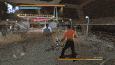 two men are fighting in a video game and one has the name keii shimokawa on his back