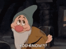 a cartoon character from snow white and the seven dwarfs is standing in a dark room and saying `` you know ? ''
