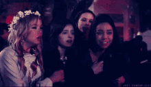 a group of women standing next to each other with the words just random gifs written below them