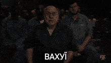 a man with a surprised look on his face and the word baxyi on the bottom