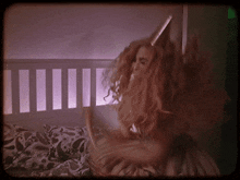 a woman with long hair and a horn on her head