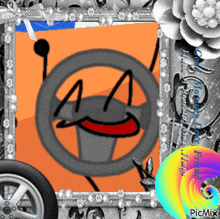 a picture of a steering wheel with a smiling face is in a frame