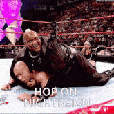 a wrestling match between two men with the words hop on nightreign on the bottom