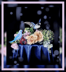 a painting of two birds sitting on top of a table with flowers