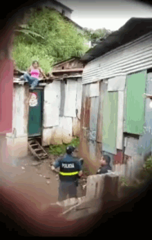 a police officer stands in front of a building