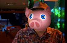 a man with a pig mask on his face