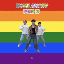 a group of people are dancing in front of a rainbow flag with the words have ahofy pride