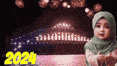 a little girl in a green hijab is standing in front of a fireworks display with the year 2024 on the bottom