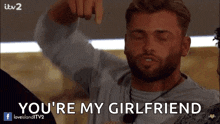 a man says " you 're my girlfriend " while pointing at himself