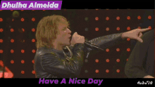 a man singing into a microphone with the words have a nice day written below him