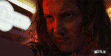 a close up of a woman 's face with netflix written in the corner