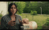 a woman in a grey sweatshirt says whatever