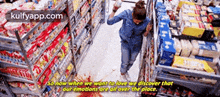 a woman is walking through a grocery store with a quote that says so now when we want to love