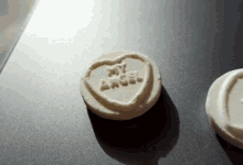 a heart shaped cookie that says my angel