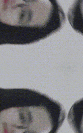 a close up of a person 's face against a white background .
