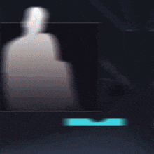 a blurred image of a person standing in a dark room with neon lights .