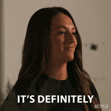 a woman says it 's definitely with a netflix logo behind her