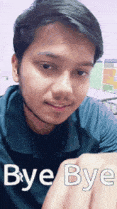 a young man with a beard is making a bye bye gesture with his hands .