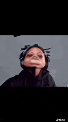 a close up of a person 's face with a mask on .