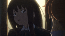 a girl with long black hair is holding a gun in her hand