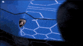 a close up of a blue lamborghini logo