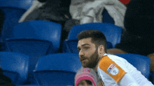 a man wearing a jersey that says sky sports on the sleeve