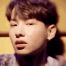 a close up of a person 's face with their eyes closed and their mouth open .