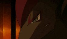a close up of a cartoon character 's face with a red eye
