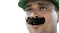 a man with a fake mustache and a green hat