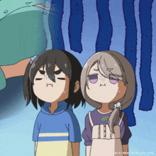 a boy and a girl are standing next to each other with their mouths open