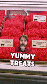 a picture of a man in front of a display of ground beef