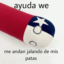 a red and white pillow with the words ayuda we me andan jalando de mis patas