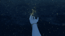 a person 's hand is reaching out towards the stars